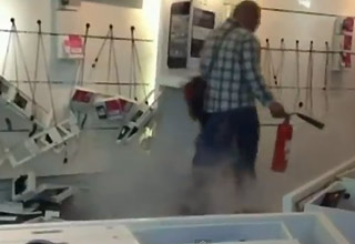Man destroys inside of mobile phone shop 