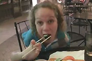 Gril eating sushi with her feet